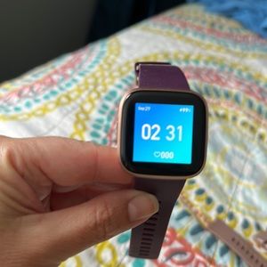 Fitbit Versa 2 with extra band. Includes charger. Very good condition.